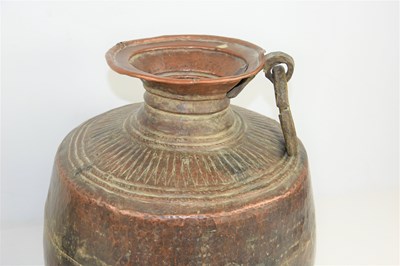 Lot 198 - A 19th century Indian Mughal hammered copper...