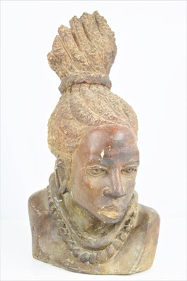 Lot 133 - An African carved soapstone bust of a native...