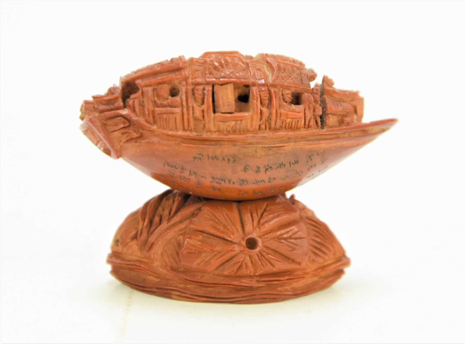 Lot 288 - A Chinese nut boat sculpture on stand,...