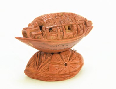 Lot 288 - A Chinese nut boat sculpture on stand,...