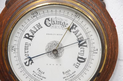 Lot 14 - A Victorian carved oak cased aneroid barometer,...