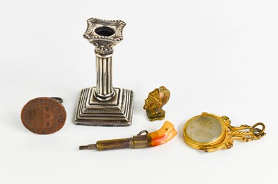 Lot 555 - A silver miniature candlestick together with a...