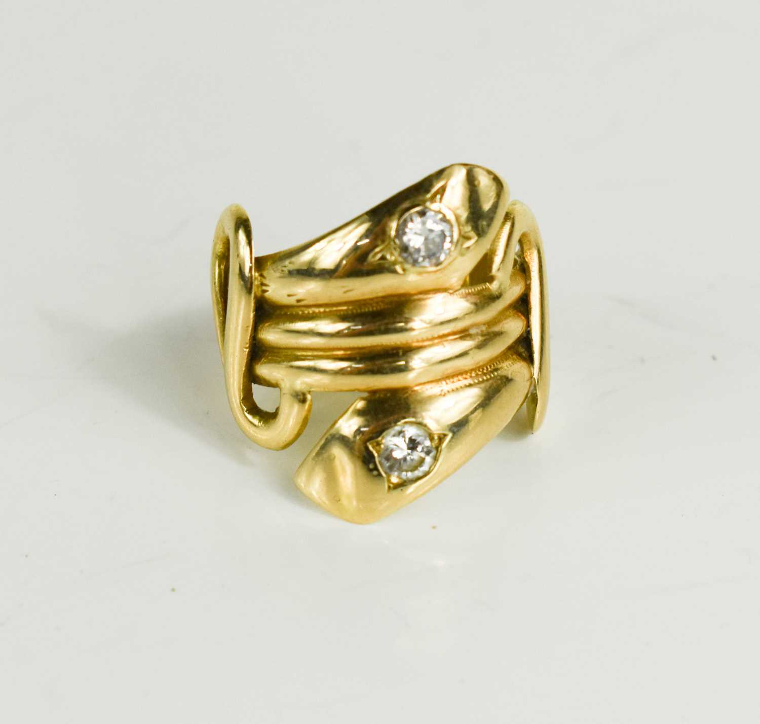 Lot 15 - A gold and diamond snake ring, tested to at...