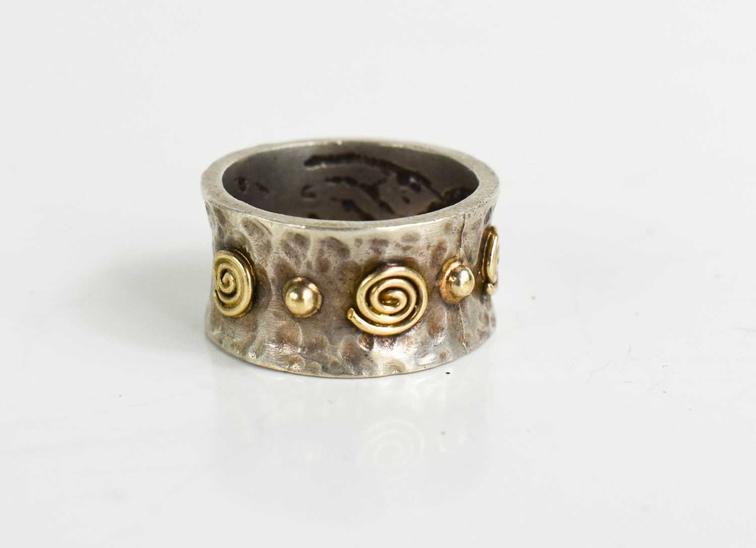 Lot 62 - A silver and gold handmade ring with a...