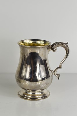 Lot 427 - A 19th century silver tankard with gilded...