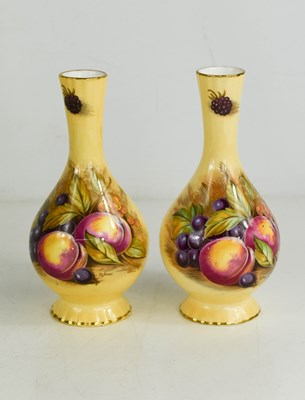 Lot 164 - A pair of Aynsley vases, painted with fruit on...