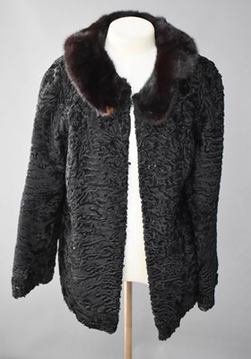 Lot 178 - A black Astrachan coat with faux fur collar.