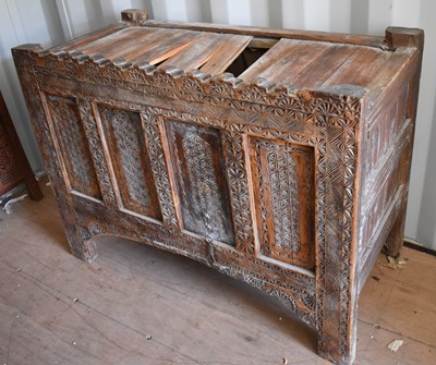 Lot 505 - A 19th century carved chest, the planked top...