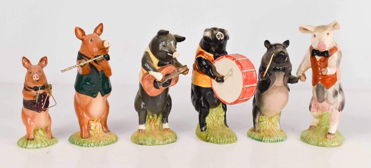 Lot 301 - A group of Beswick pottery musical pigs,...