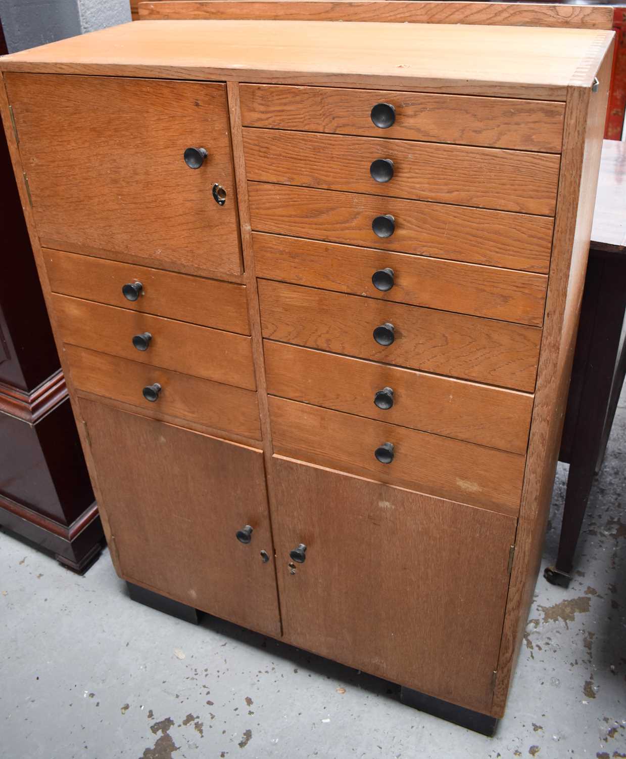 Lot 488 - A mid century beech haberdashery cabinet,...