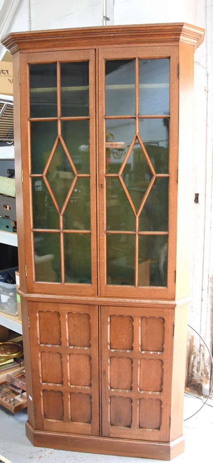 Lot 593 - An oak gun display cabinet, with glazed upper...