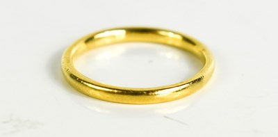 Lot 112 - A 22ct gold wedding band, 5.38g.
