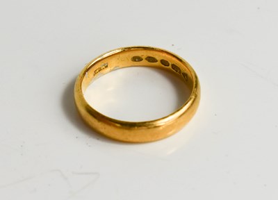 Lot 82 - A 22ct gold wedding band, size O, 5.4g.