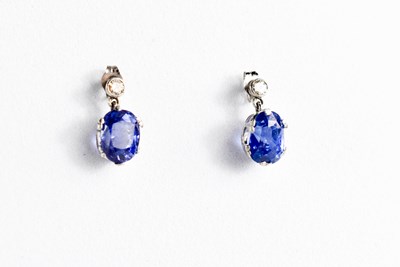 Lot 49 - A pair of white gold, blue sapphire and...