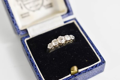 Lot 63 - An 18ct gold and diamond five stone graduated...