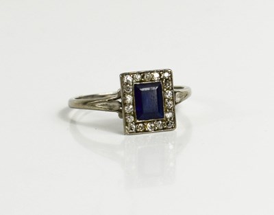 Lot 51 - A white metal, diamond and sapphire ring, the...