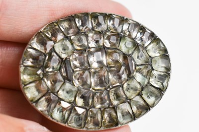 Lot 35 - A Georgian silver and gemset oval brooch, 4cm...