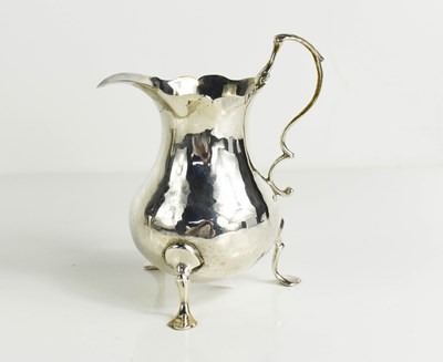 Lot 78 - A 19th century silver milk jug, raised on...