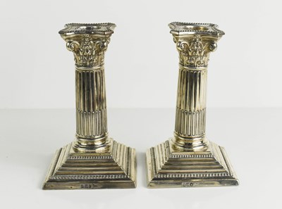 Lot 137 - A pair of silver candlesticks, in the form of...