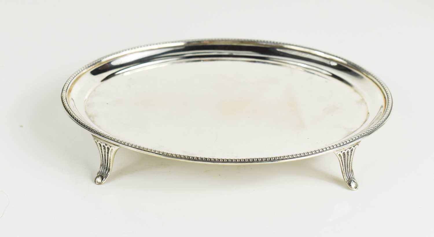 Lot 131 - A silver card tray, of oval form, with splayed...