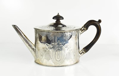 Lot 135 - A silver Edwardian tea pot, engraved with...