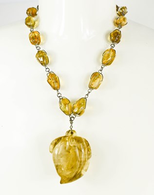 Lot 107 - A vintage smokey quartz / rock crystal pendant...