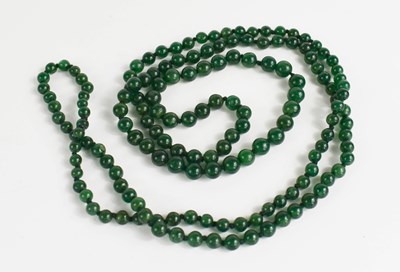 Lot 98 - A jade single stranded beaded necklace, of...