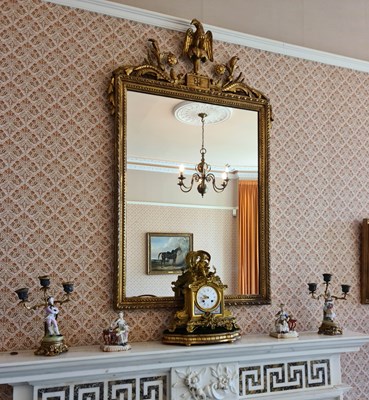 Lot 123 - A 20th century gilded wall mirror, the...