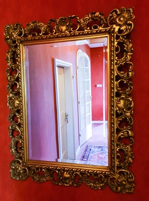 Lot 127 - A 20th century giltwood wall mirror, with...