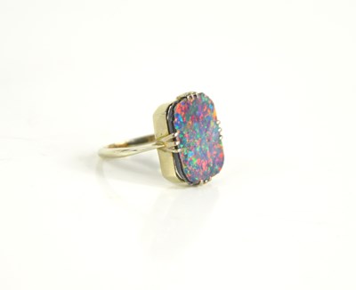 Lot 138 - A black opal doublet ring set in unmarked...