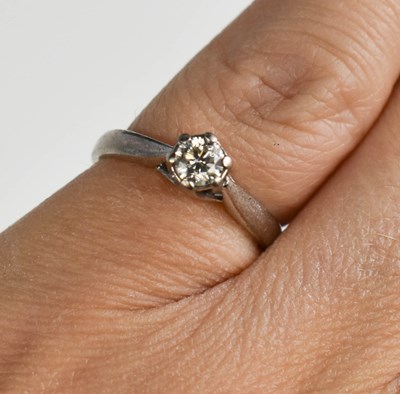 Lot 139 - An 18ct white gold and diamond solitaire ring,...