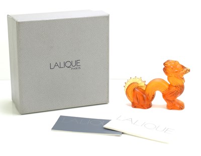 Lot 144 - A Lalique amber coloured glass model of a...