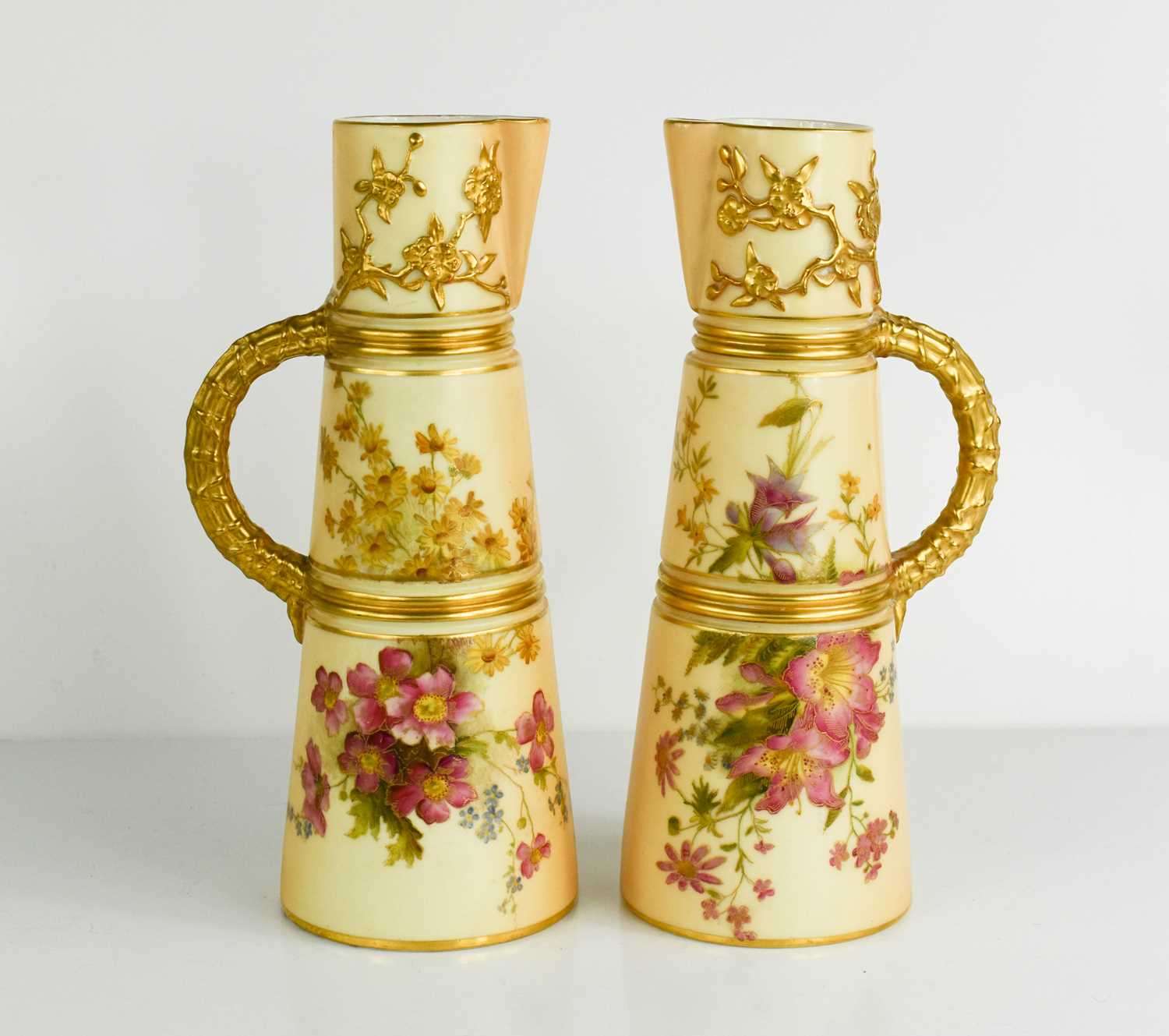 Lot 484 - A pair of Royal Worcester jugs, the peach...