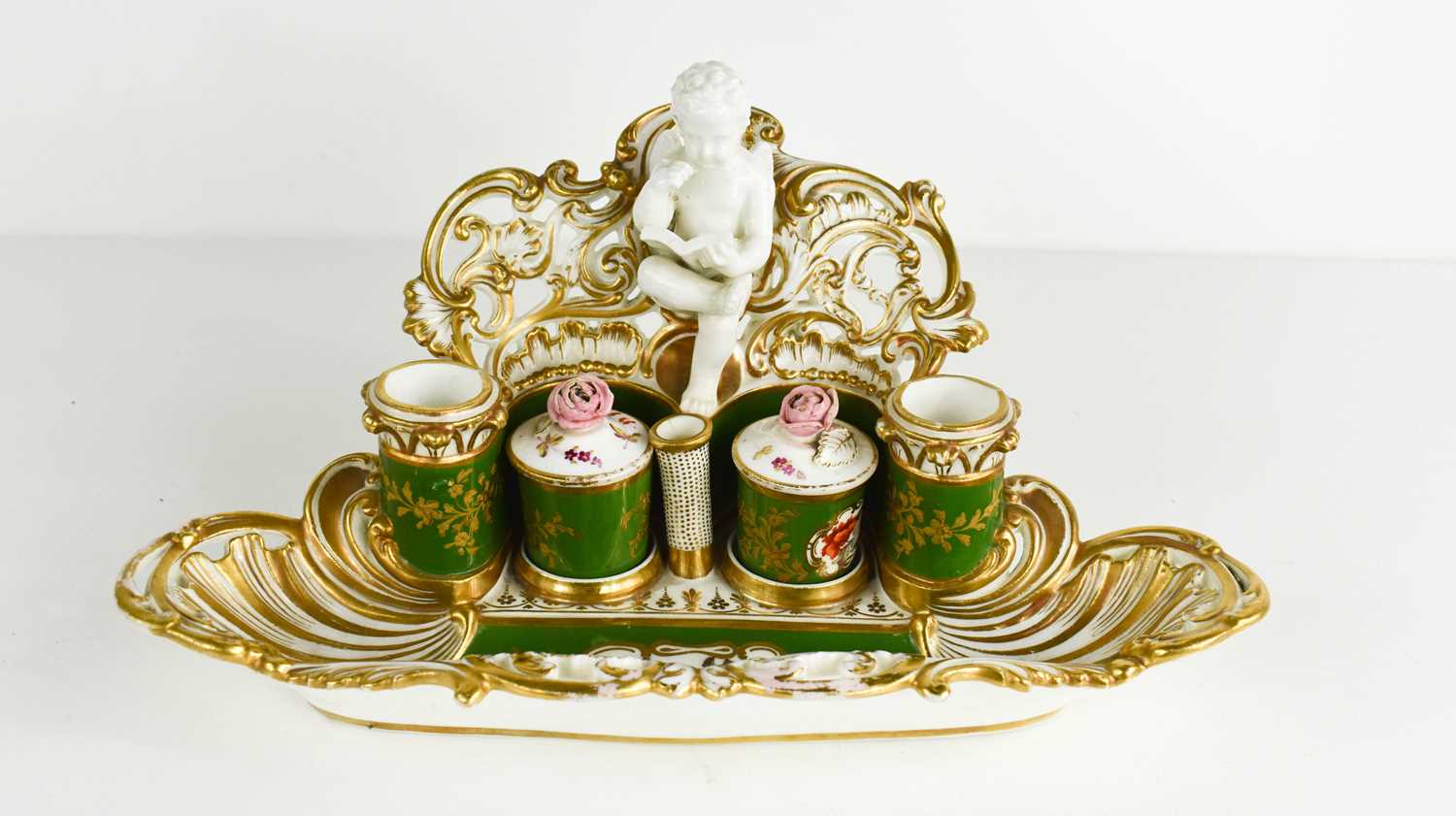 Lot 512 - A 19th century desk stand with a cherub...