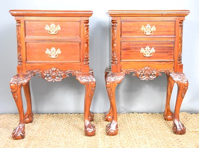 Lot 599 - A pair of carved and mahogany bedside table...