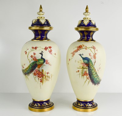 Lot 125 - A pair of Royal Worcester vase and covers,...
