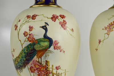 Lot 125 - A pair of Royal Worcester vase and covers,...