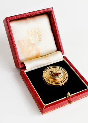 Lot 2 - A 9ct gold pill box and lid, by Cartier, the...
