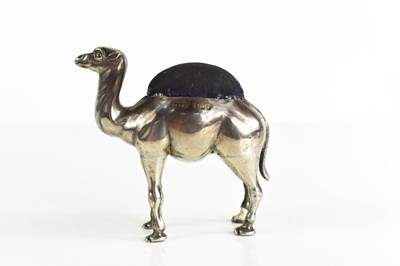 Lot 461 - A silver hallmarked pin cushion of a camel,...