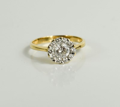 Lot 163 - An 18ct gold (tested as) and diamond cluster...