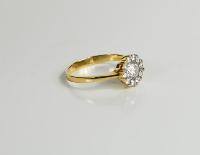 Lot 163 - An 18ct gold (tested as) and diamond cluster...