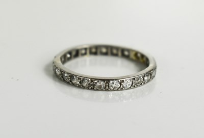 Lot 108 - An Art Deco platinum and diamond eternity ring,...