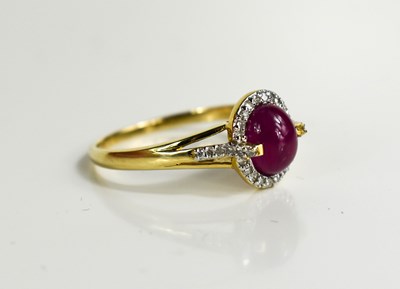 Lot 140 - A 9ct gold cabochon ruby and diamond ring,...
