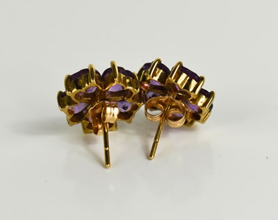 Lot 104 - A 9ct gold and amethyst flowerhead stud...