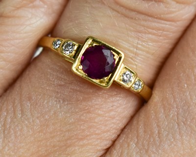 Lot 154 - An 18ct gold brilliant cut ruby, with step...