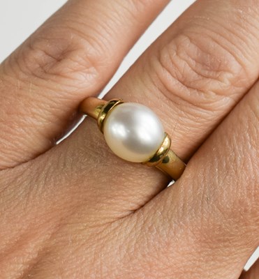 Lot 28 - A 9ct gold and pearl ring, size O, 3.5g.