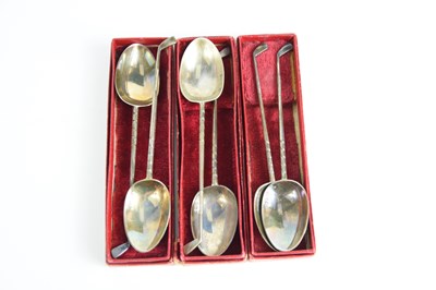 Lot 332 - A set of six silver golfing spoons with golf...