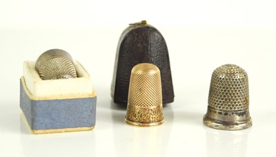 Lot 296 - A gold thimble together with two silver...