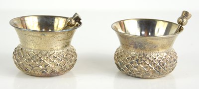 Lot 450 - A pair of silver thistle form salts and spoons,...