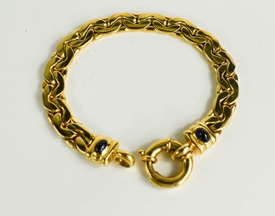 Lot 174 - A yellow metal and cabochon sapphire chain...